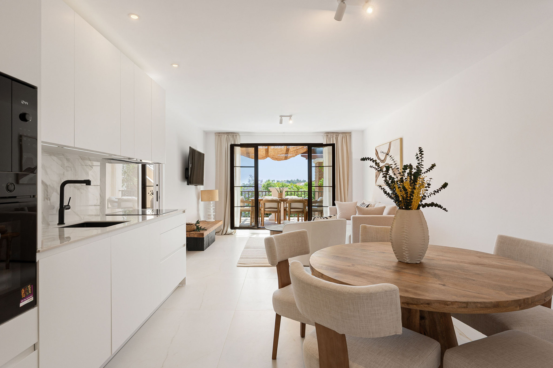 Welcome to this beautifully renovated penthouse offering bright, contemporary living in a tranquil Andalusian urbanization! · Photo 20